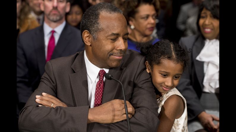 Carson greets Tesora prior to testifying before the Senate Committee of Banking, Housing and Urban Affairs in January. <a href="index.php?page=&url=http%3A%2F%2Fwww.cnn.com%2F2017%2F01%2F12%2Fpolitics%2Fben-carson-hud-confirmation-hearing%2F" target="_blank">In his opening statement,</a> he noted that he was raised by a single mother who had a "third-grade education" and made the case that he understands the issues facing the millions of people who rely on HUD programs.