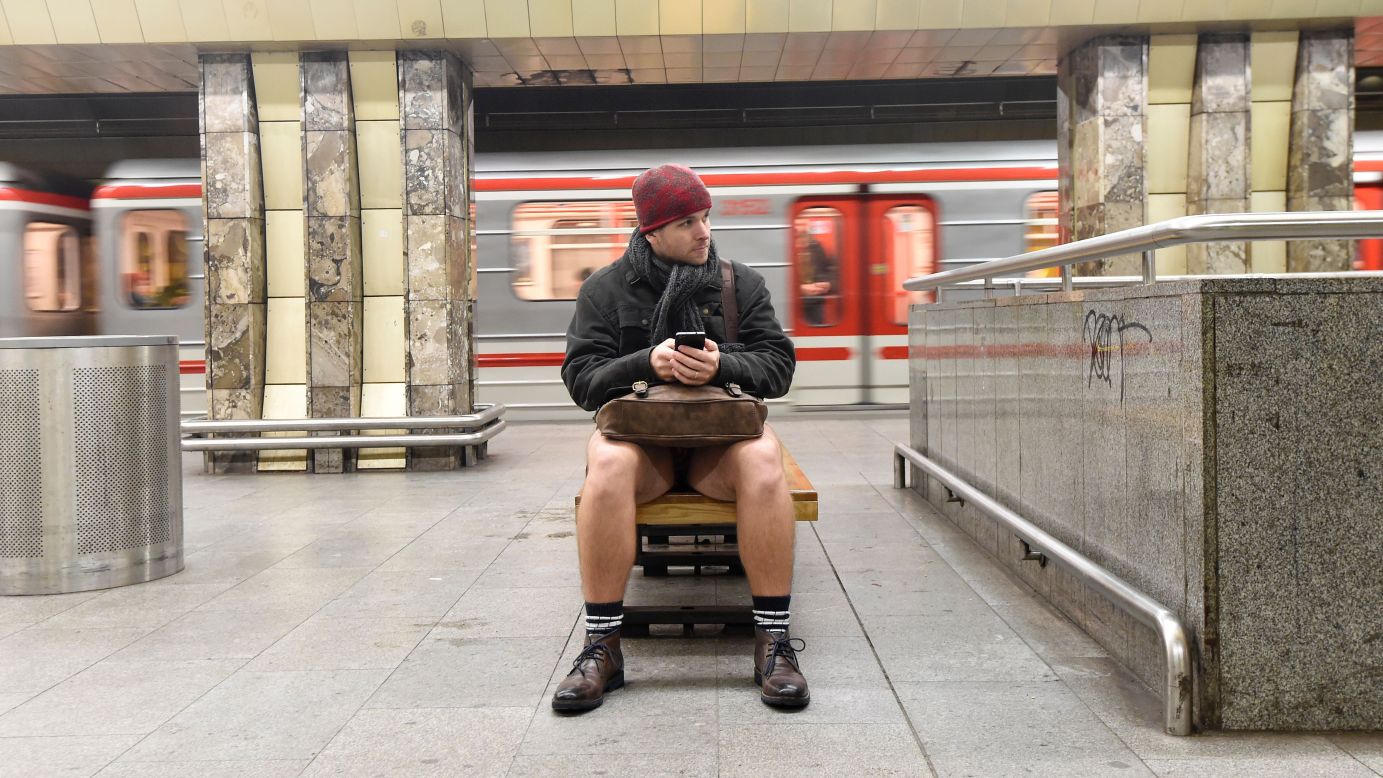 A man without pants sits on a subway platform in Prague, Czech, Republic, on Sunday, January 8. The annual "No Pants Subway Ride" was started in 2002 by Improv Everywhere in New York. It has spread to many cities across the globe.