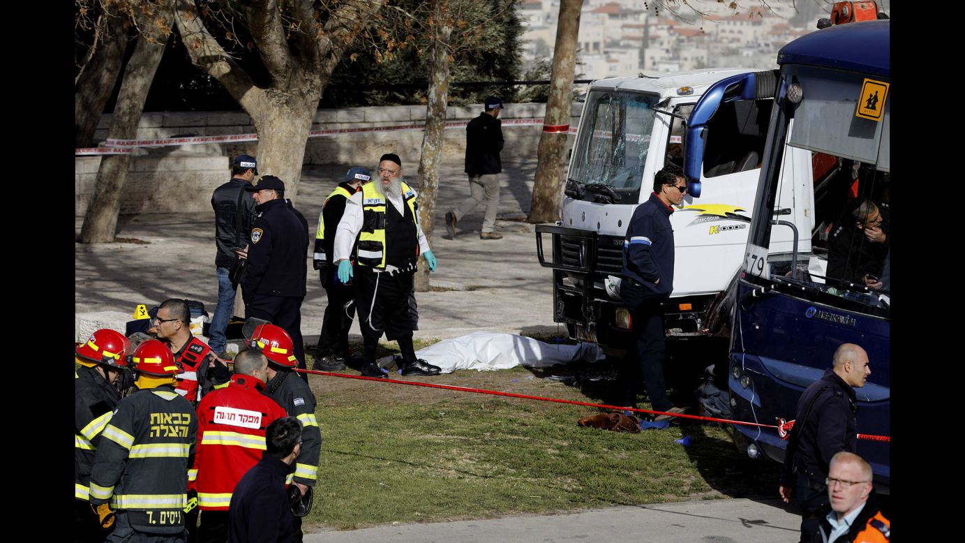 Israeli security forces and emergency personnel gather at the site of <a href="http://www.cnn.com/2017/01/08/middleeast/jerusalem-vehicle-attack/index.html" target="_blank">a truck attack in Jerusalem</a> on Sunday, January 8. A driver plowed a truck into a group of soldiers in Jerusalem, killing four people and injuring at least 10.