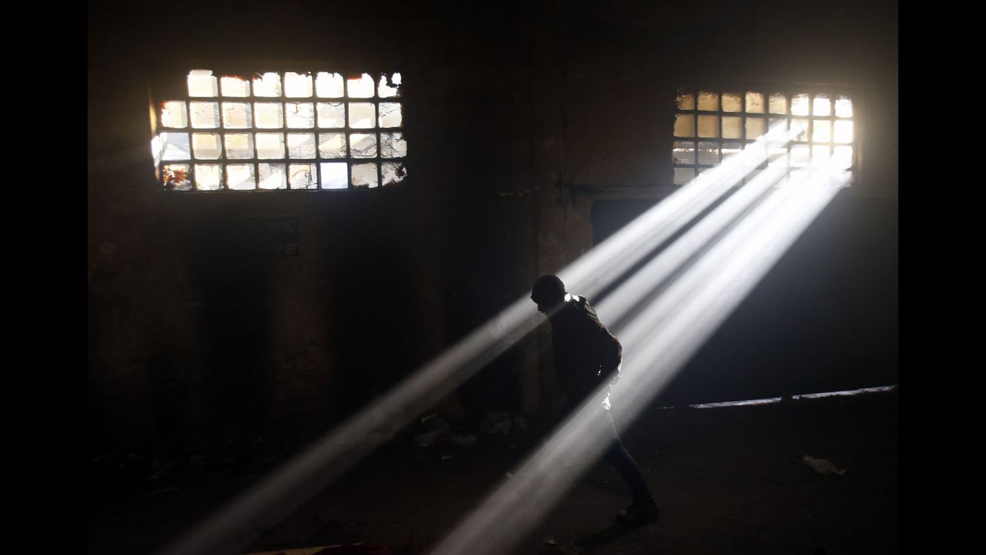 A migrant walks through an abandoned warehouse in Belgrade, Serbia, on Sunday, January 8. Up to 2,000 migrants, mainly from Afghanistan, <a href="http://www.cnn.com/2017/01/11/europe/refugees-belgrade-europe-cold-snap/" target="_blank">are living at the warehouse</a> and trying to survive the freezing winter with no heating and no warm water. 