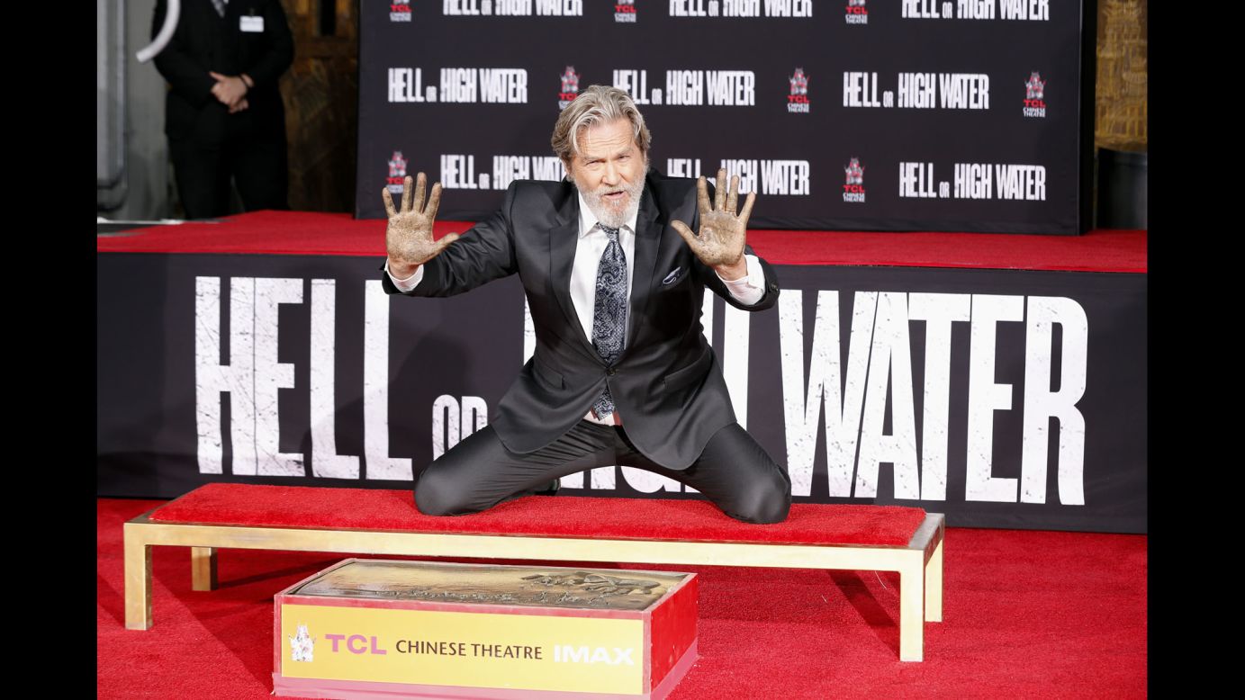Actor Jeff Bridges leaves his handprints and footprints at the TCL Chinese Theatre in Hollywood on Friday, January 6.