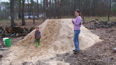 Broookings' daughter Hope with her brother Roman in the early stages of building the house