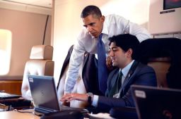 Former White House staff speechwriter Aneesh Raman works with President Obama aboard Air Force One in 2014. 