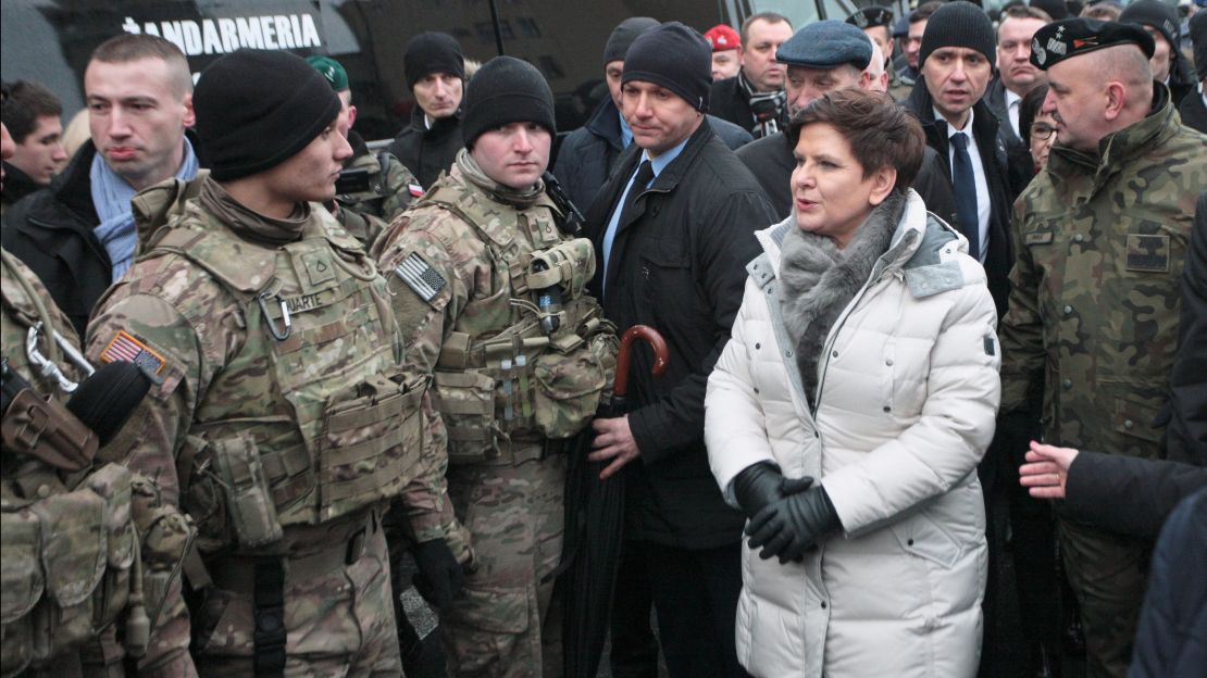 Polish Prime Minister Beata Szydlo speaks with members of the US army during an official welcome event for US troops in Zagan, Poland, on January 14.