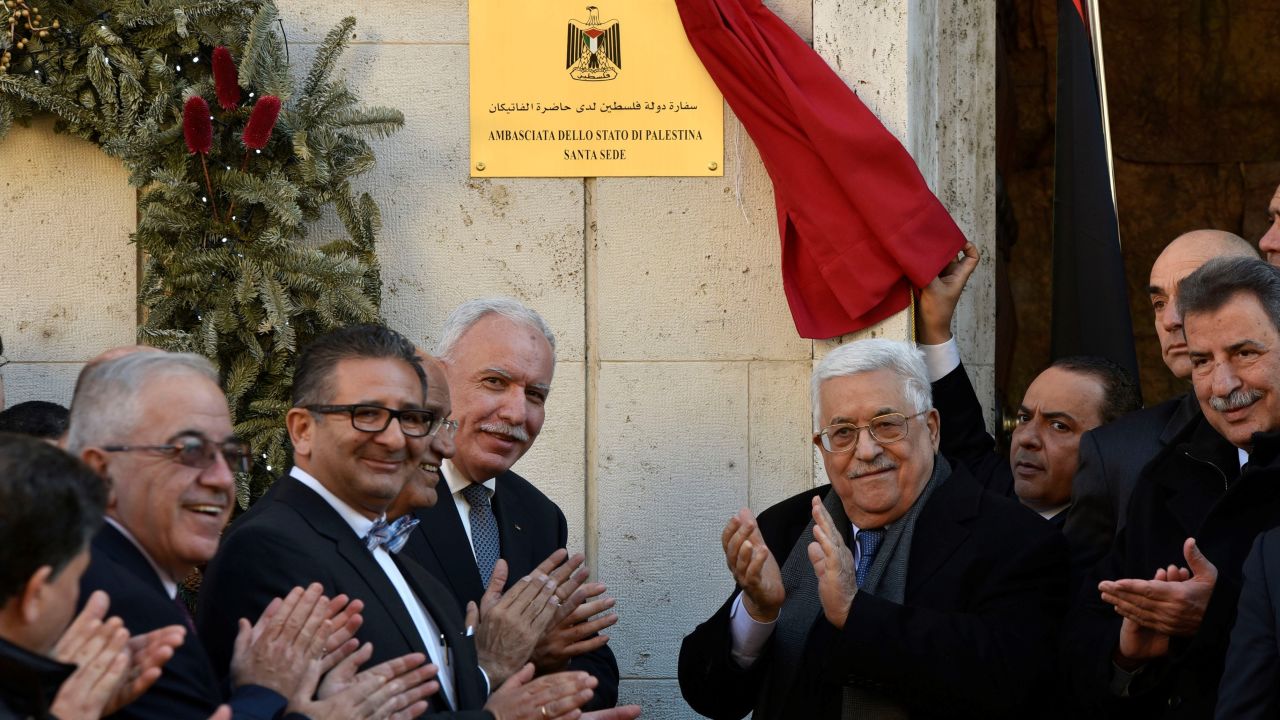 Palestinian President Mahmoud Abbas applauds the opening of the Palestinian Embassy in Vatican City.
