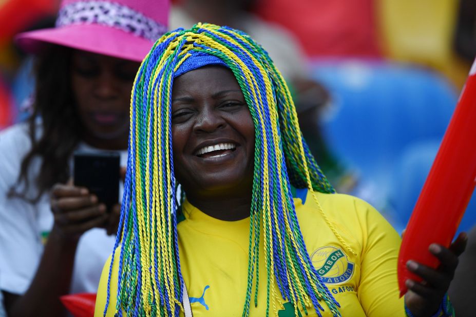 A Gabon supporter cheers before the home nation met tournament debutant Guinea-Bissau at the Stade de l'Amitie Sino-Gabonaise.