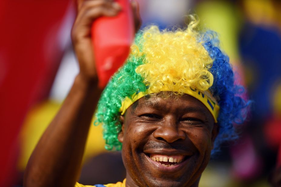 Another supporter of host nation Gabon wears a wig displaying national colors.