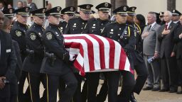 The flag-draped casket is carried to the hearse during funeral services for Orlando Police Master Sgt. Debra Clayton at the First Baptist Church in Orlando on Saturday, Jan. 14, 2017. Clayton, who was gunned down was remembered Saturday at her funeral service as someone who put everyone at ease with her infectious smile and made every effort to bridge the gap between law enforcement and the community it served. (Stephen M. Dowell/Orlando Sentinel via AP)