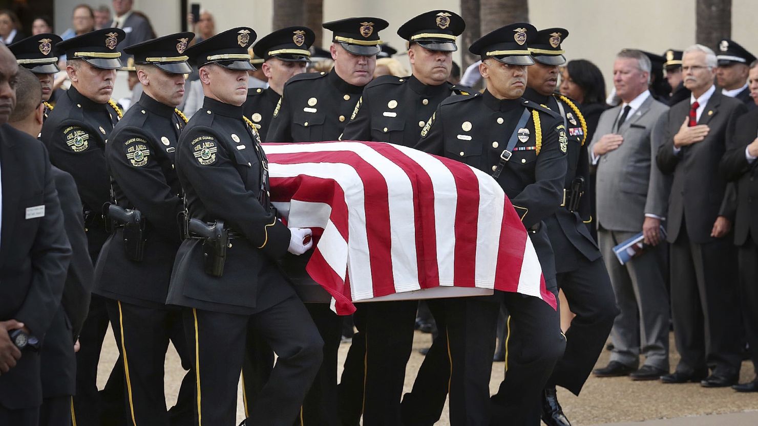 The flag-draped casket of Master Sgt. Debra Clayton is carried to the hearse during her funeral in Orlando at the First Baptist Church on January 14, 2017.