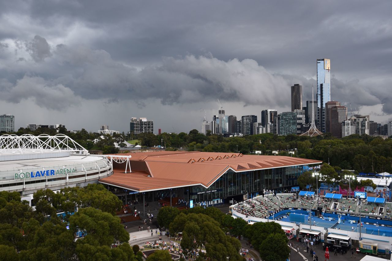 The city of Melbourne towers in the skyline behind Melbourne Park and the Rod Laver Arena -- the tournament's main show-court. 