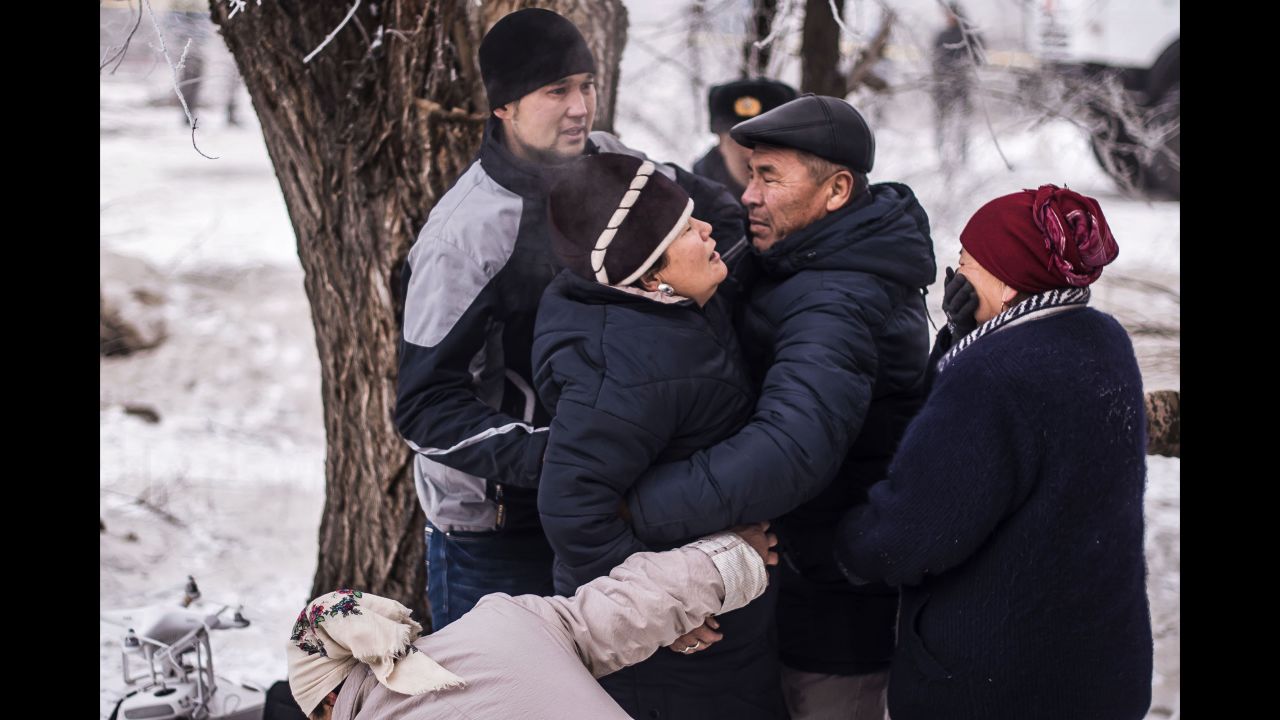 Residents comfort one another at the crash site.