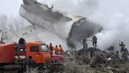Kyrgyz Emergency Ministry officials work among remains of a crashed Turkish Boeing 747 cargo plane at a residential area outside Bishkek, Kyrgyzstan Monday, Jan. 16, 2017. The cargo plane crashed Monday morning, killing people in the residential area adjacent to the Manas airport as well as those on the plane. (AP Photo/Vladimir Voronin)