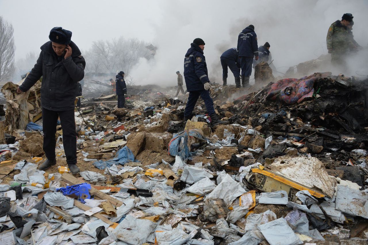 Rescue workers comb through debris at the site of the crash. The Boeing 747 was traveling from Hong Kong to Kyrgyzstan's capital, Bishkek, according to data from the tracking website FlightRadar24.