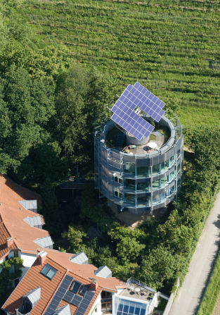 The roof is fitted with solar panels -- this building claims to have been the first in the world to capture more energy than it uses.