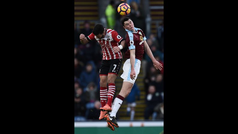 Burnley's English defender Michael Keane, right, and Southampton's Irish striker Shane Long jump to head the ball during an English Premier League football match in Burnley, England, on January 14.