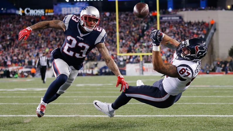 Patrick Chung of the New England Patriots, left, watches as C.J. Fiedorowicz of the Houston Texans misses a catch in the first half during the AFC Divisional Playoff Game on January 14 in Massachusetts. The Patriots won 34-16.