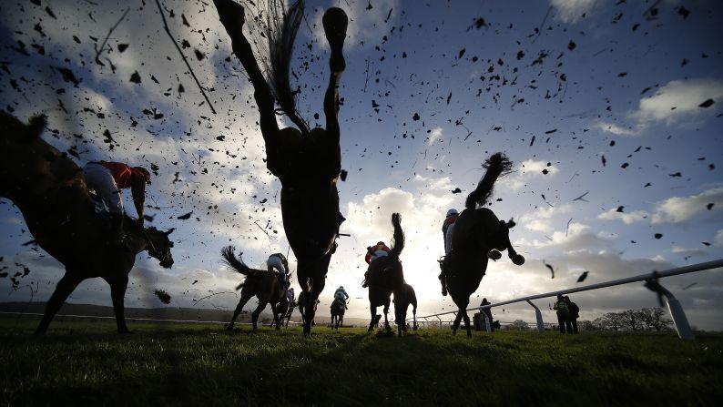 Horses leap over a fence at Taunton Racecourse on January 11 in Taunton, England. 