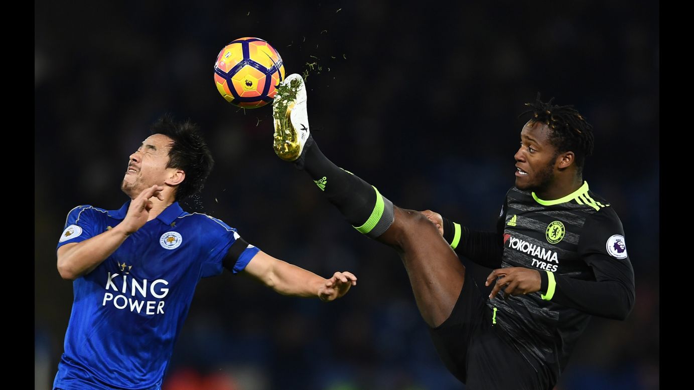Shinji Okazaki of Leicester City, left, reacts as Michy Batshuayi of Chelsea battles for the ball during the Premier League match on January 14 in Leicester, England.