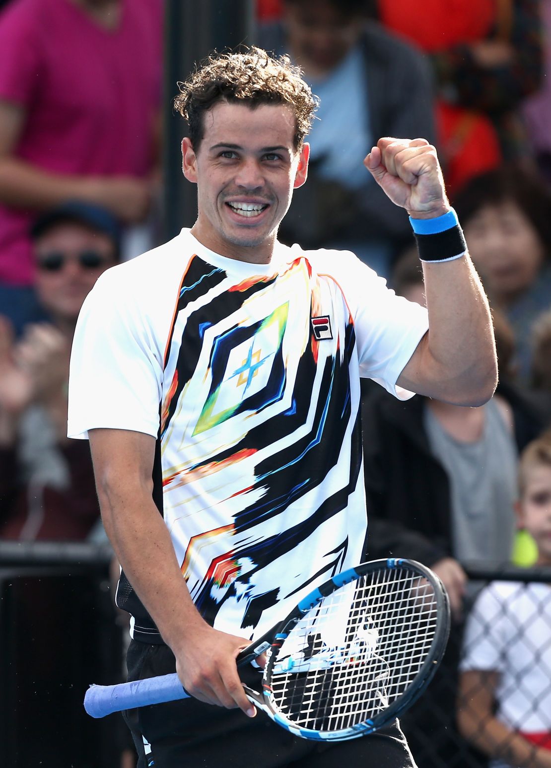 Alex Bolt celebrates after winning a place in the main draw in Melbourne. 