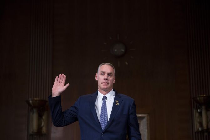 Zinke, a former Navy SEAL, is sworn in before <a href="index.php?page=&url=http%3A%2F%2Fwww.cnn.com%2F2017%2F01%2F17%2Fpolitics%2Fryan-zinke-interior-secretary-confirmation-hearing%2F" target="_blank">his confirmation hearing</a> in January. He pledged to review Obama administration actions that limit oil and gas drilling in Alaska, and he said he does not believe climate change is a hoax.