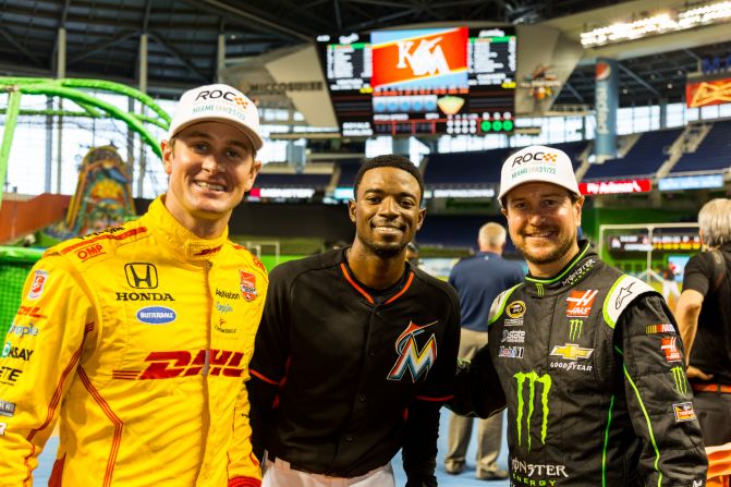 The 2014 Indianapolis 500 winner Ryan Hunter-Reay (left) and NASCAR driver -- and baseball fan -- Kurt Busch (right) meet Miami Marlins second baseman Dee Gordon ahead of ROC.