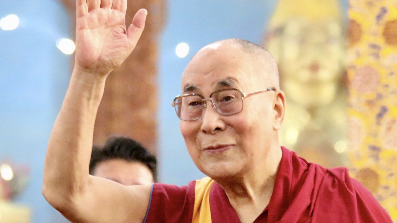 The Dalai Lama waives to his fans at the Emory-Tibet symposium of Scholars and Scientists held at the Drepung Monastic University in December.