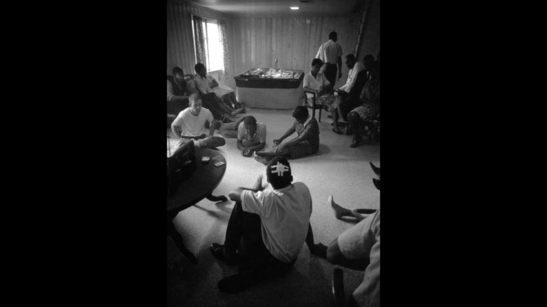 Lewis, with his head bandaged, relaxes with fellow Freedom Riders at a safe house in Montgomery.