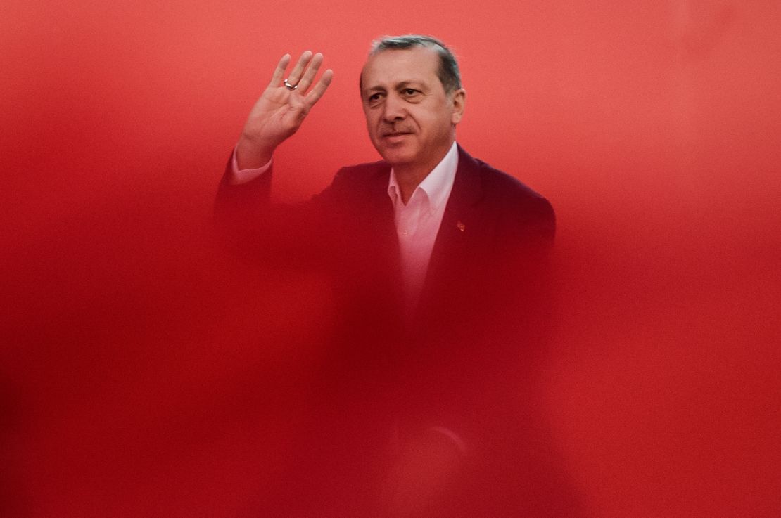 Recep Tayyip Erdogan greets supporters on August 7, 2016 during a rally against July's failed military coup.