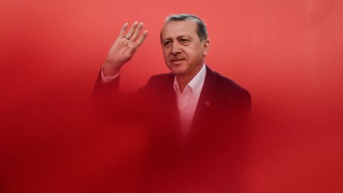 Recep Tayyip Erdogan greets supporters on August 7, 2016 during a rally against July's failed military coup.