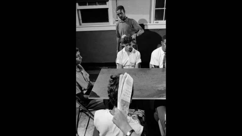 Trainers in Petersburg, Virginia, use newspapers to swat volunteers in the head and prepare them for harassment they might encounter during a sit-in.