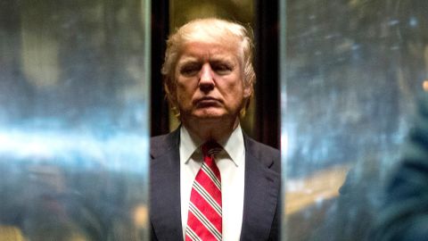 US President-elect Donald Trump boards the elevator after escorting Martin Luther King III to the lobby after meetings at Trump Tower in New York City on January 16, 2017. / AFP / DOMINICK REUTER (Photo credit should read DOMINICK REUTER/AFP/Getty Images)