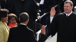 Barack Obama is sworn in as the 44th US president by Supreme Court Chief Justice John Roberts in front of the Capitol in Washington on January 20, 2009. At left is Michelle and Sasha Obama.