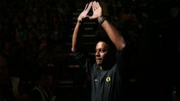 Oregon head football coach Willie Taggart flashed the sign of the O as he is intro ducted during halftime at the Oregon vs. Oregon State NCAA college basketball game Saturday, Jan. 14, 2017, in Eugene, Ore. (AP Photo/Chris Pietsch)