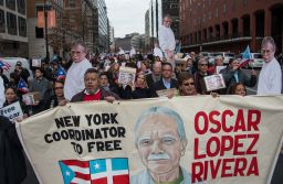 People march to demand the release of Puerto Rican nationalist Oscar Lopez Rivera near the White House in Washington, DC, on January 11, 2017, shortly before Obama commuted his sentence.