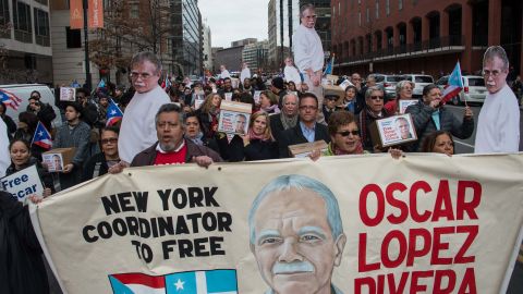 People march to demand the release of Puerto Rican nationalist Oscar Lopez Rivera near the White House in Washington, DC, on January 11, 2017, shortly before Obama commuted his sentence.