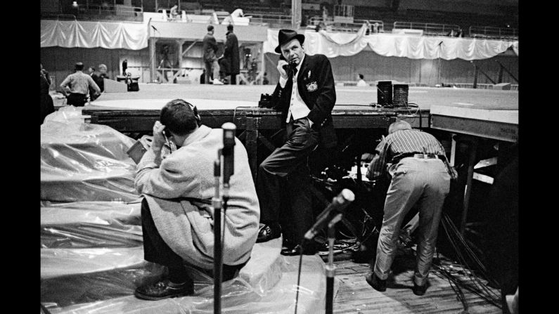 Legendary entertainer Frank Sinatra, center, prepares for the inaugural gala the night before Kennedy's inauguration. Sinatra had campaigned for Kennedy and had worked to organize a star-studded gala for him. Among those who attended were Harry Belafonte, Nat King Cole, Gene Kelly and Bette Davis.