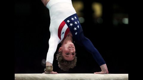 Kerri Strug vaults during the women's team gymnastics competition at the Summer Olympic Games in Atlanta in July 1996. Strug injured her left ankle following this routine but completed her second vault to clinch the team gold medal for the US women.