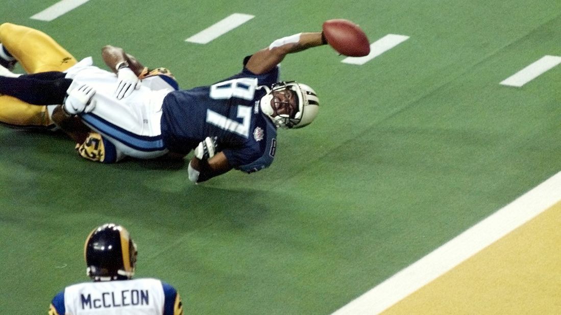 Tennessee Titans wide receiver Kevin Dyson falls short of the goal line when St. Louis Rams linebacker Mike Jones tackles him as time runs out in Super Bowl XXXIV in January 2000. The Rams defeated the Tennessee Titans 23-16.