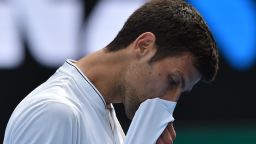 Serbia's Novak Djokovic reacts after a point against Uzbekistan's Denis Istomin during their men's singles match on day four of the Australian Open tennis tournament in Melbourne on January 19, 2017. / AFP / PAUL CROCK / IMAGE RESTRICTED TO EDITORIAL USE - STRICTLY NO COMMERCIAL USE        (Photo credit should read PAUL CROCK/AFP/Getty Images)