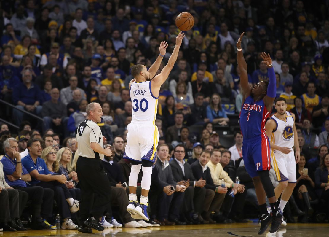 Steph Curry launches a jumper against the Pistons.