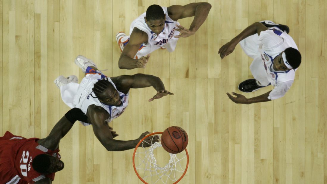 Ohio State center Greg Oden and Florida's Chris Richard, from left, Al Horford and Corey Brewer wait for a rebound in the NCAA men's basketball championship game in April 2007. Florida won the national title 84-75.