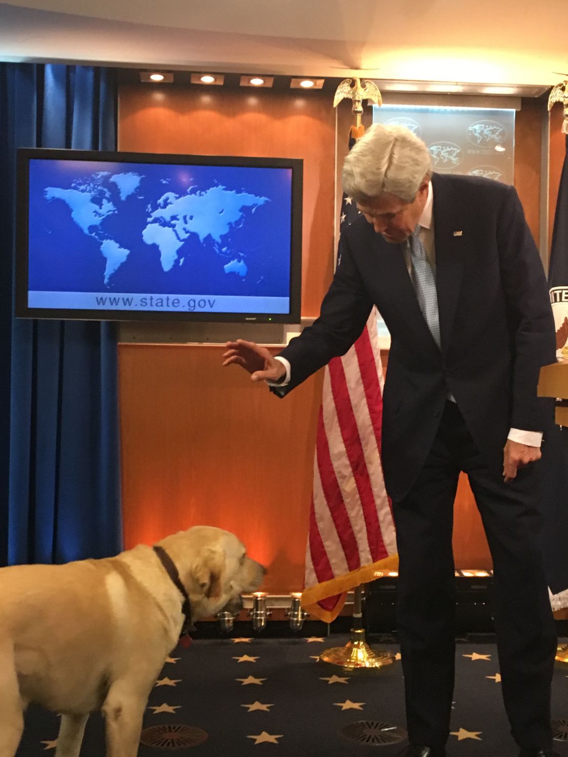John Kerry and his dog at his final State Department press conference.