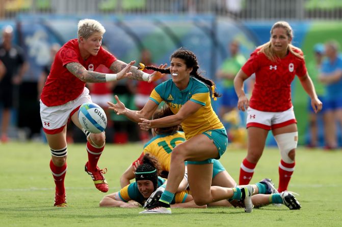 "In sevens we tend to look at staying above the ball, protecting the ball whilst engaging in that ruck, that breakdown, so when that ball is presented, we can play away." Here, Australia's Charlotte Caslick starts another cycle of play after her grounded teammates retain possession.