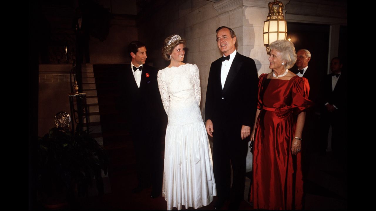 The Bushes smile next to Britain's Prince Charles and Princess Diana during a dinner at the British Embassy in Washington.