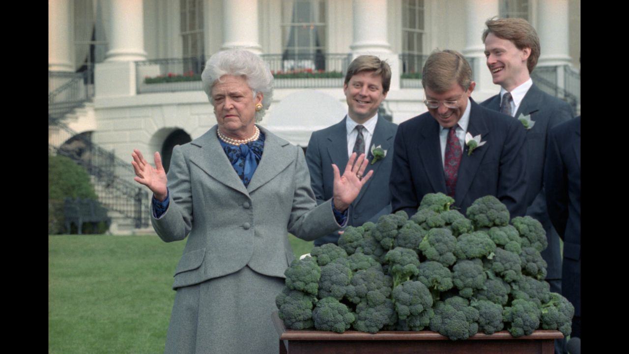 The first lady accepts three cases of broccoli from a California grower's association during a ceremony at the White House in Washington. The group shipped a total of 10 tons of broccoli after President Bush proclaimed his dislike for the vegetable. The remaining broccoli went to area food banks.