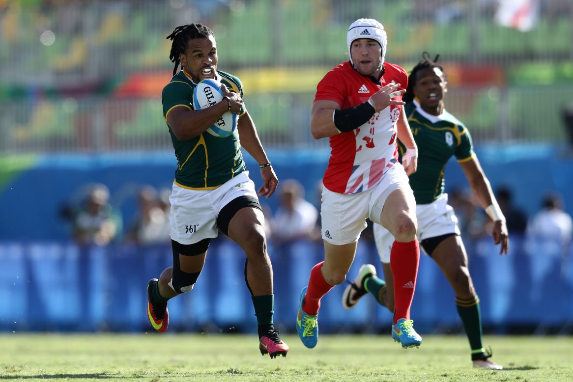 "We work a lot on anticipation, reading what a ball carrier would do. In sevens a missed tackle or a line break is largely what tries come from."  Here South Africa's Rosko Specman bursts through Great Britain's defensive line at the 2016 Olympics. 