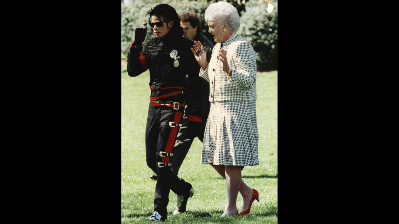 Pop star Michael Jackson walks with the first lady near the White House Rose Garden.