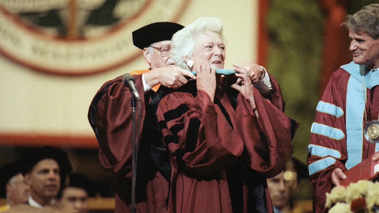 Barbara Bush has a doctoral hood placed over her shoulders during Northeastern University's spring commencement on June 15, 1991. Bush was the commencement speaker and recipient of an honorary doctorate for public service.