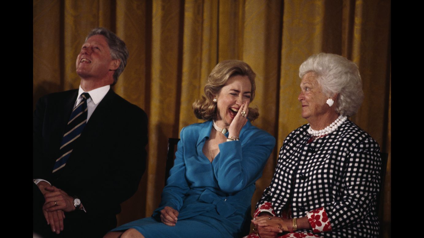 Bush sits beside Bill Clinton and his wife, Hillary. Bill Clinton, the 42nd President of the United States, defeated George H.W. Bush in the 1992 presidential election.