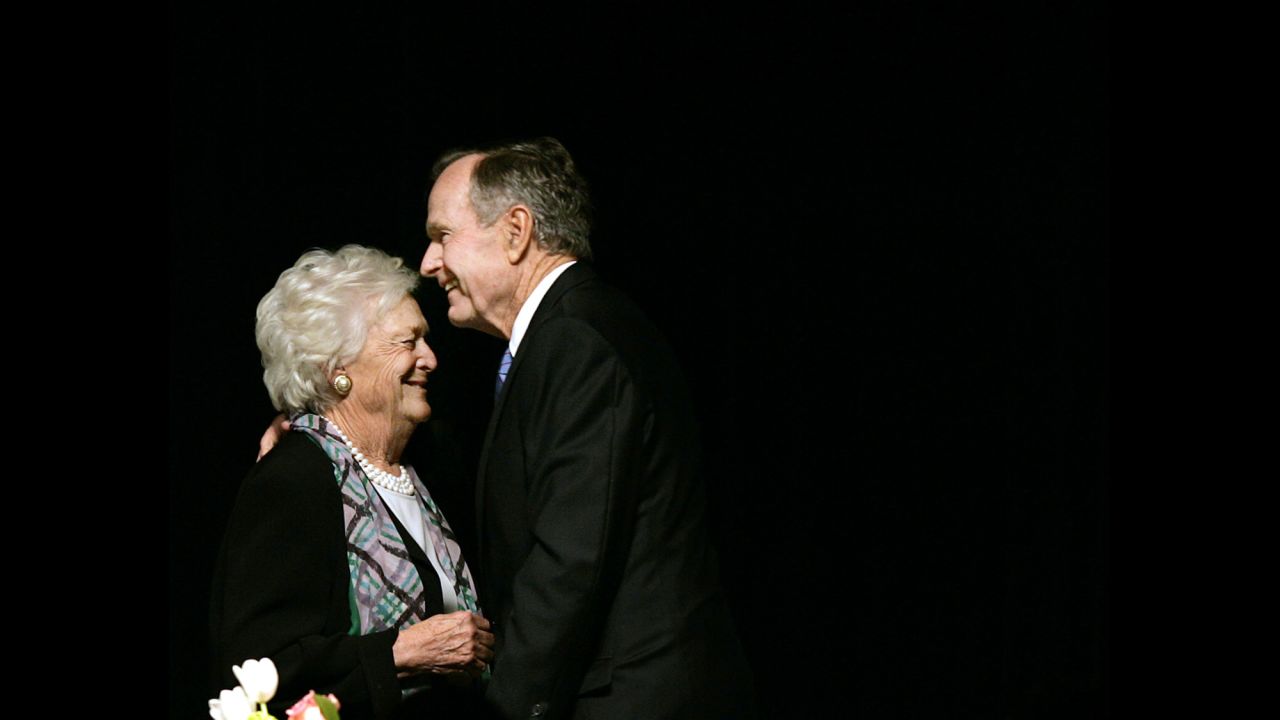 The former President embraces his wife after she introduced him at a Mother's Day Luncheon in Dallas on May 3, 2006.